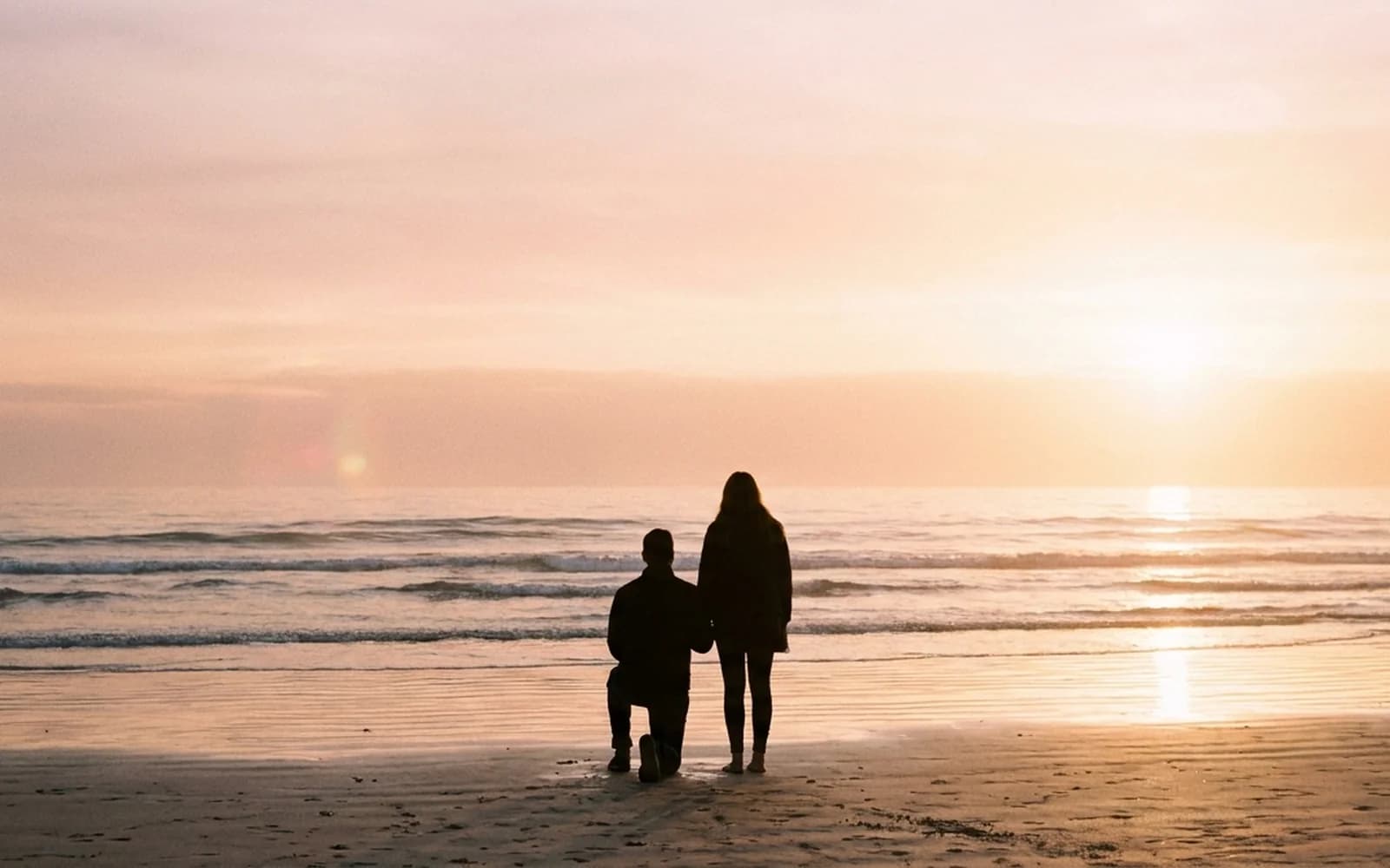 Sunset beach proposal silhouette on a South East Queensland beach